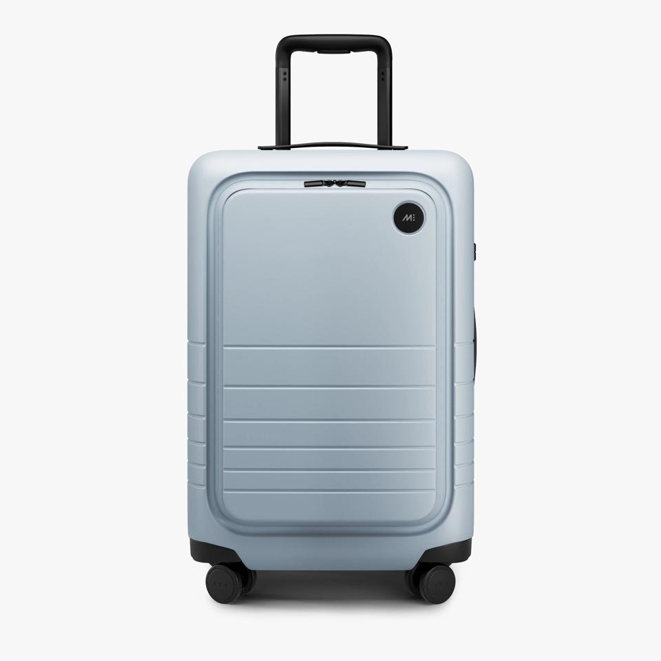 Blue suitcase against white background.