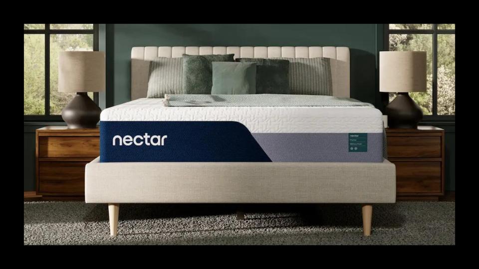 A lifestyle image of the Nectar Premier mattress in a green bedroom.