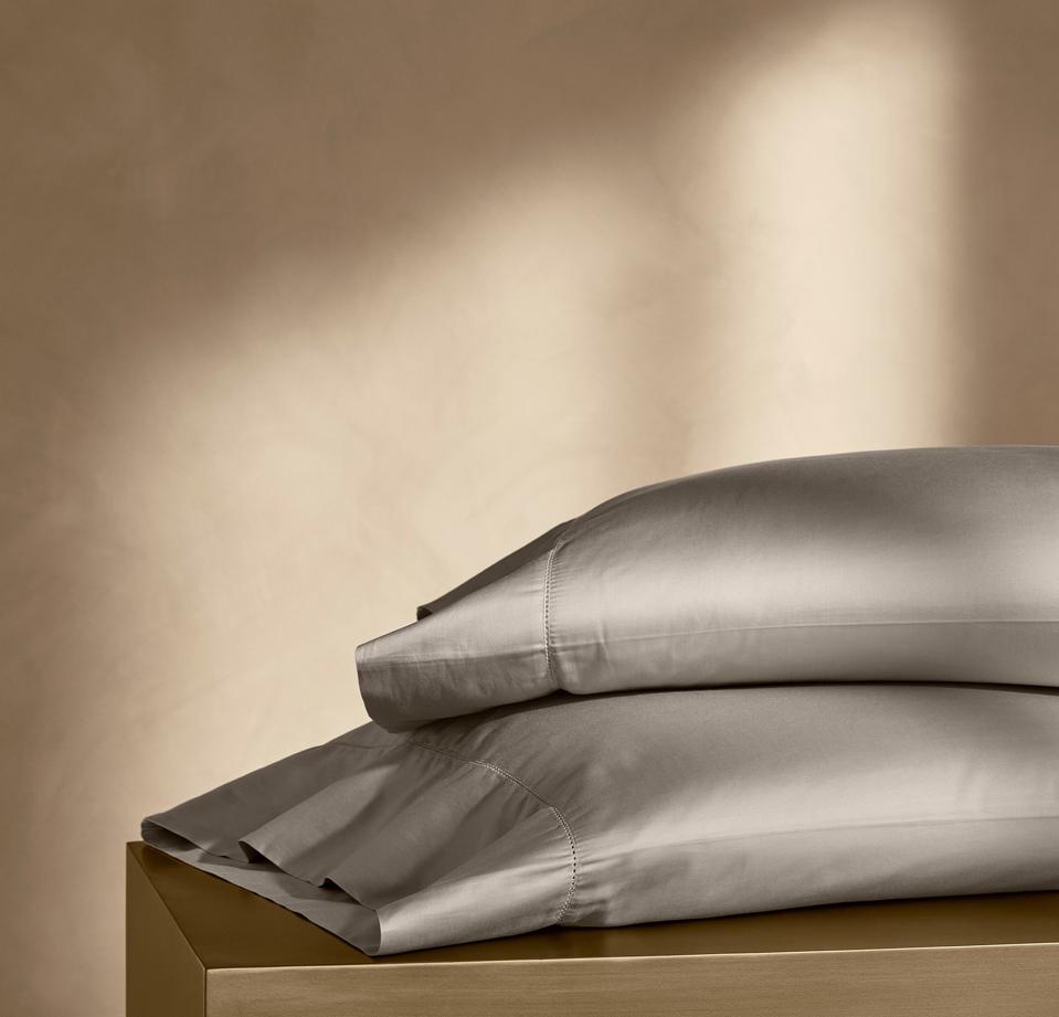 Boll & Branch Summit Supima Pillowcase Set in Pewter on a gold background