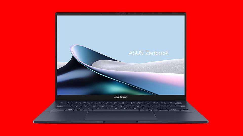 An Asus Zenbook 14 OLED laptop on a red background