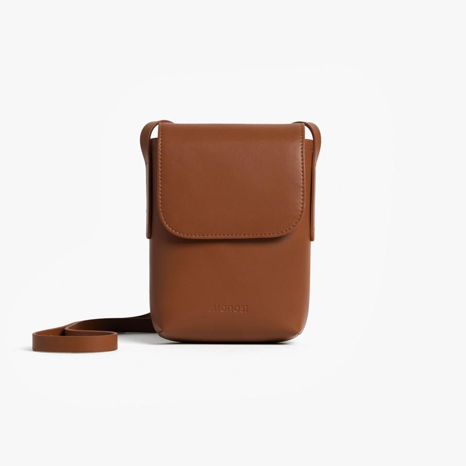 Brown crossbody bag against a white background.