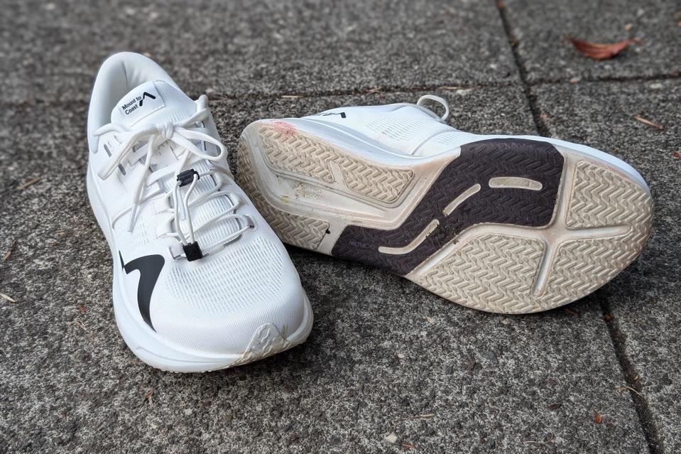 Mount to Coast R1 ultra running shoes on a concrete background