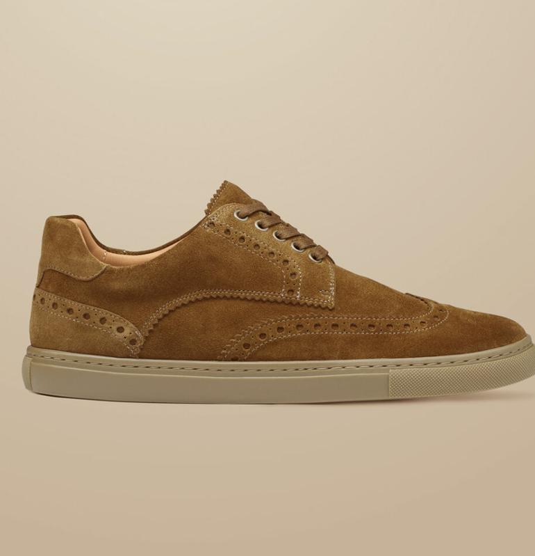 Charles Tyrwhitt Brogue sneakers against a beige background