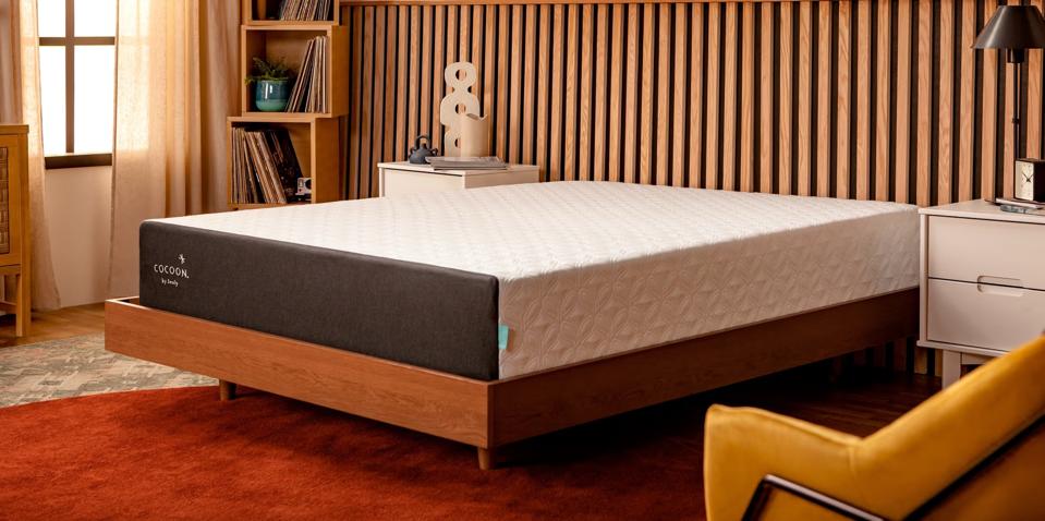 Cocoon Chill Mattress in a mid-century modern bedroom with wood panel walls. 