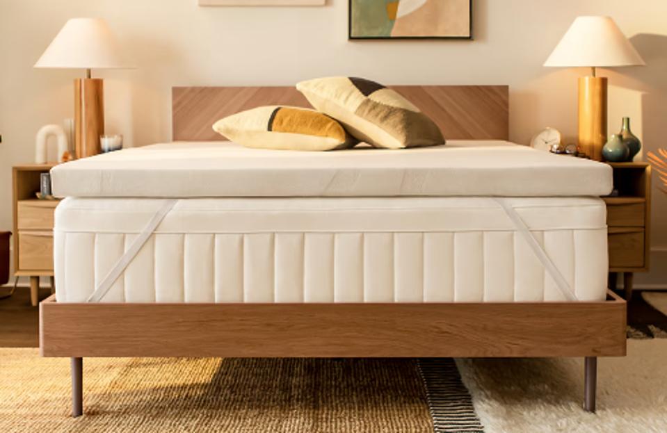 The TEMPUR-Adapt Mattress Topper on a mattress in a bedroom