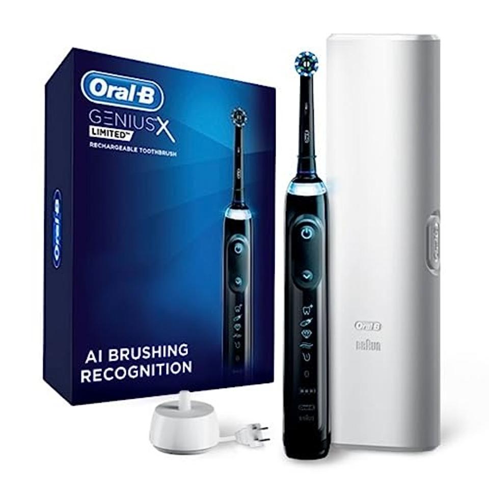 Product shot of a black Oral-B Genius X Rechargeable Electric Toothbrush with accessories