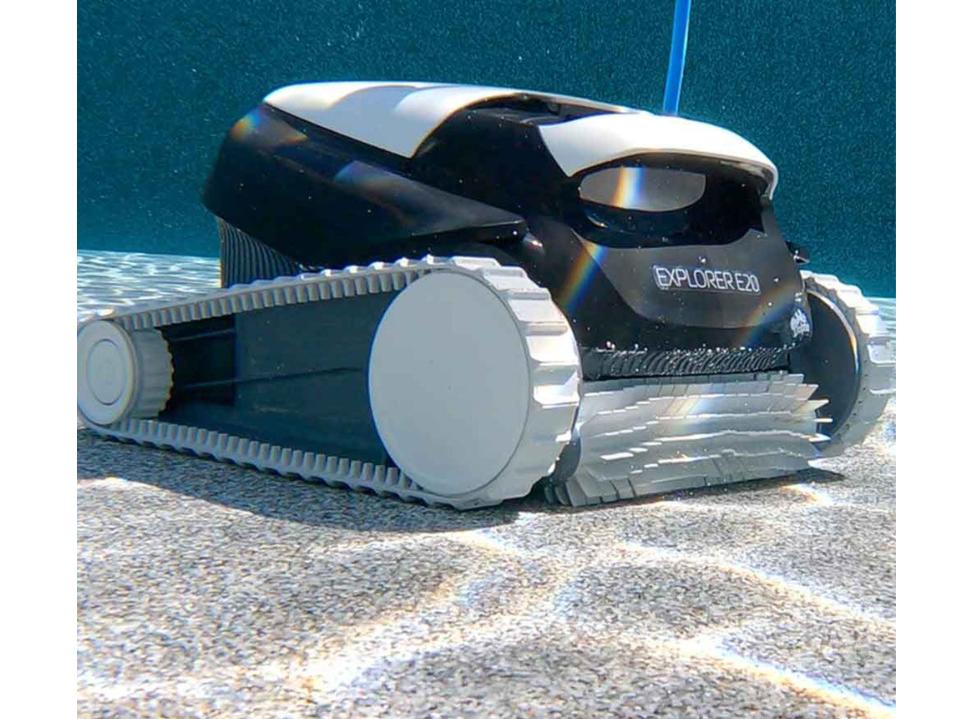 photo of Dolphin Explorer E20 robot vacuum in pool on sandy bottom