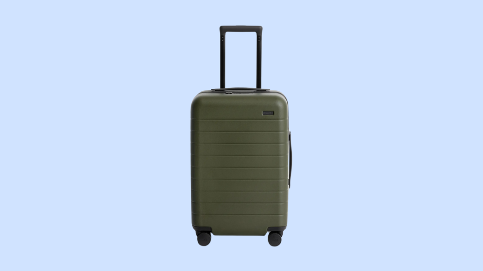 A green suitcase against a blue background.