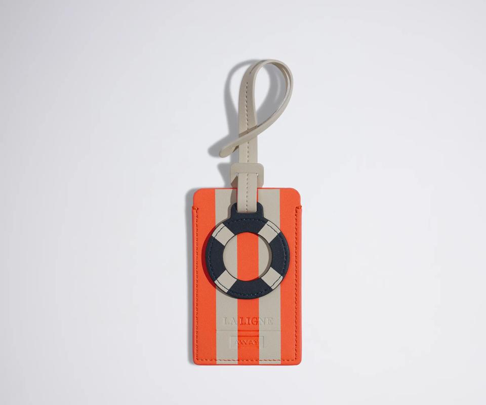 A striped luggage tag and luggage charm.