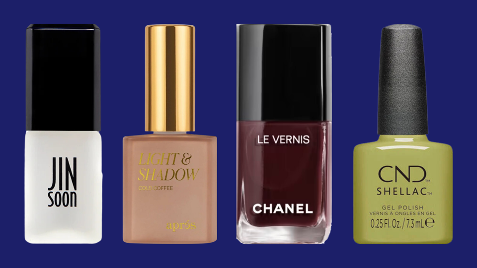 Four nail polish bottles against navy blue background