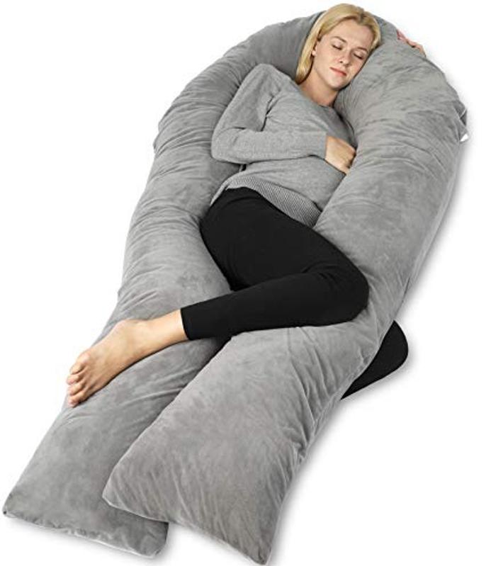 Woman with a Queen Rose Pregnancy Pillow and a Gray Velvet Cover