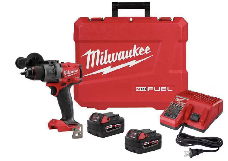 Milwaukee Drill in red with 2 batteries, charger and a hard case