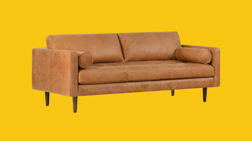 The Poly & Bark Napa Sofa on a yellow background.