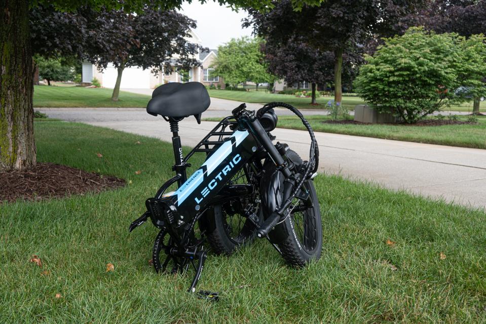 Lectric ebike olded up on a patch of grass