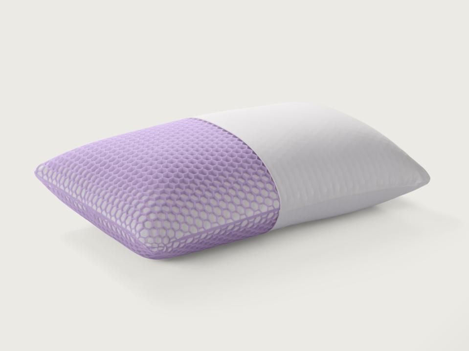 The Purple Harmony Pillow with a cover on half of it and the other half showing materials