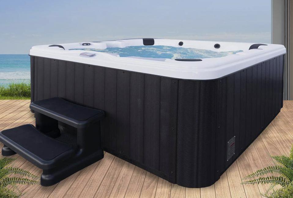 American Spas 6-Person 45-Jet Premium Acrylic Lounger Hot Tub with Bluetooth Sound System and LED Waterfall AM745L