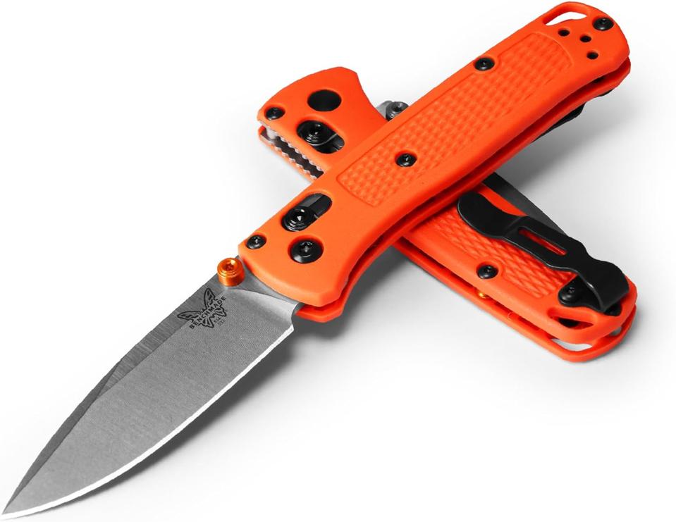 Benchmade Mini Bugout with an orange handle and straight edge blade