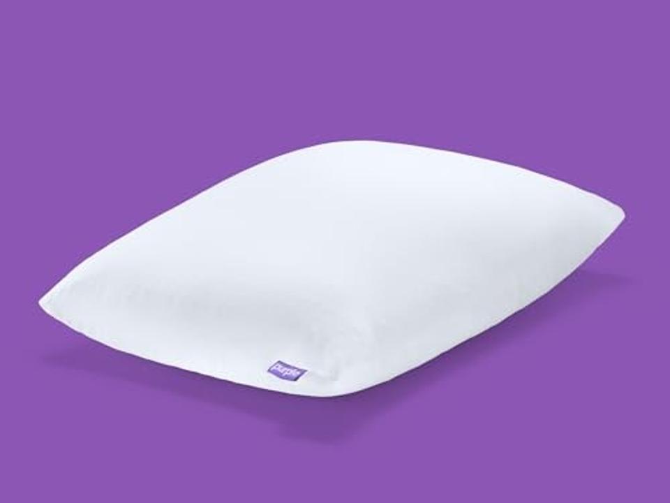 Purple Freeform Pillow on purple background.