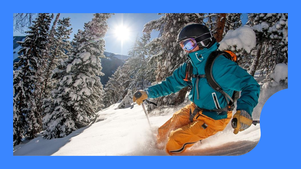 A man skiing in the trees