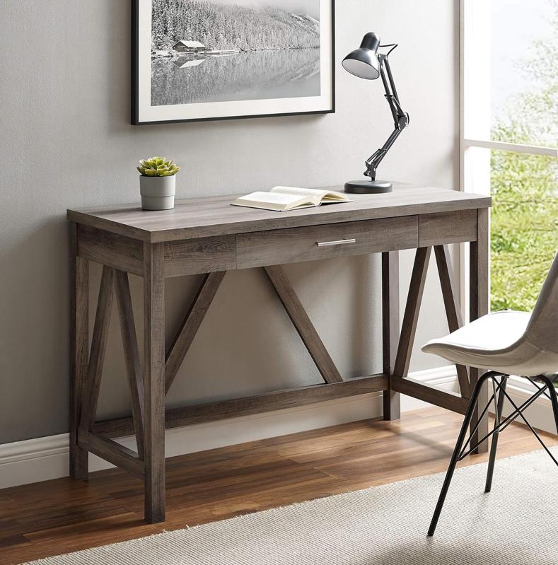 Walker Edison Rustic Desk in a gray office with a lamp and book on the desktop