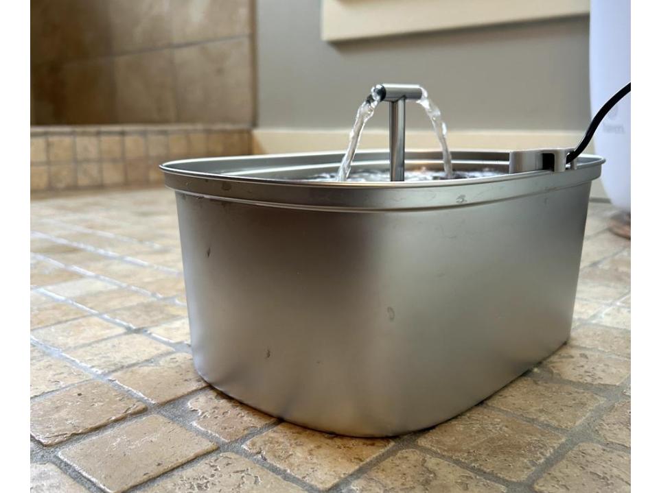 original photo of rellaty stainless steel cat water fountain running in bathroom in daytime