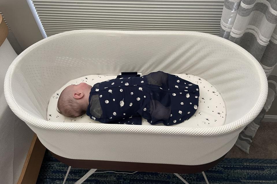 The author's baby sleeping in the Snoo.