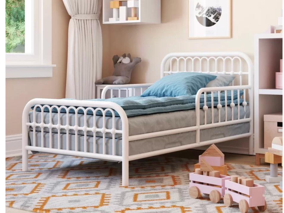 Little Seeds Monarch Hill Ivy Toddler Bed in white metal in a kids room 