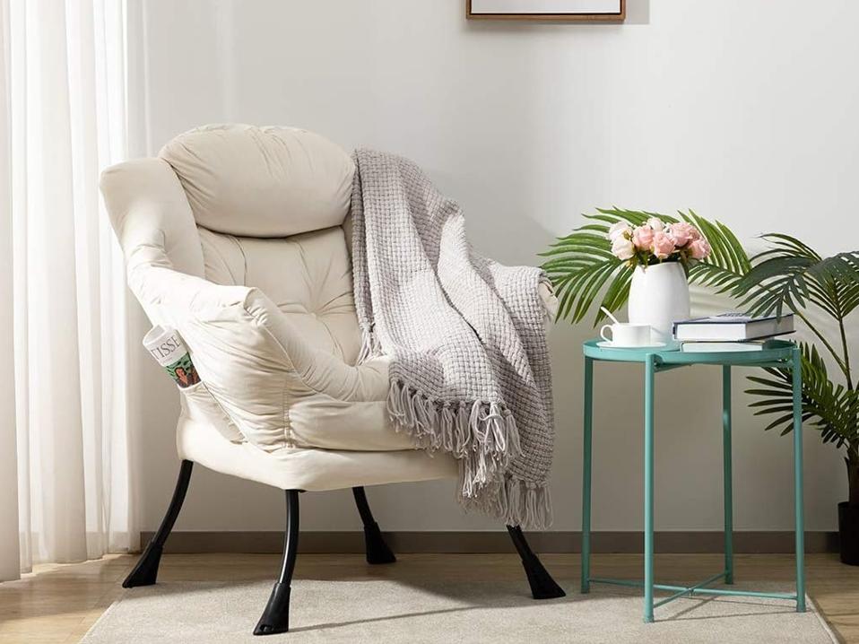 The HollyHOME Modern Chair in a living room with a gray blanket drapped over its arm