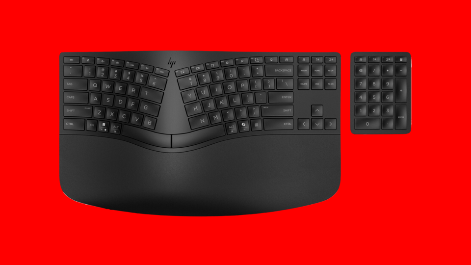 The HP 960 Wireless Keyboard against a bright red background.