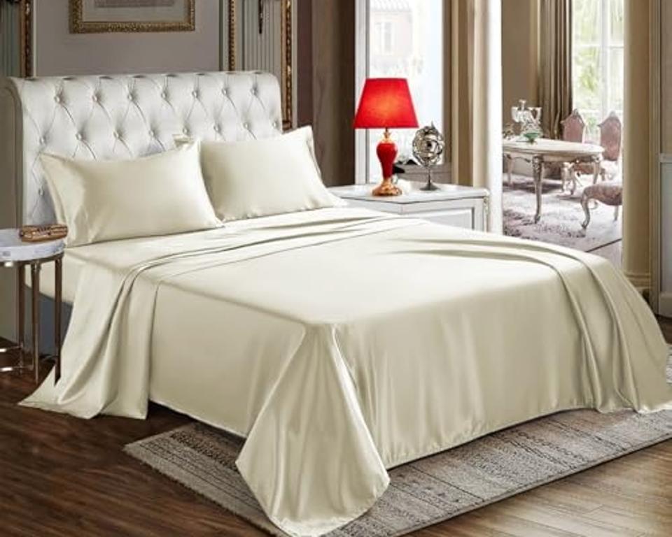 CozyLux Satin Sheets in beige on a bed in a bedroom