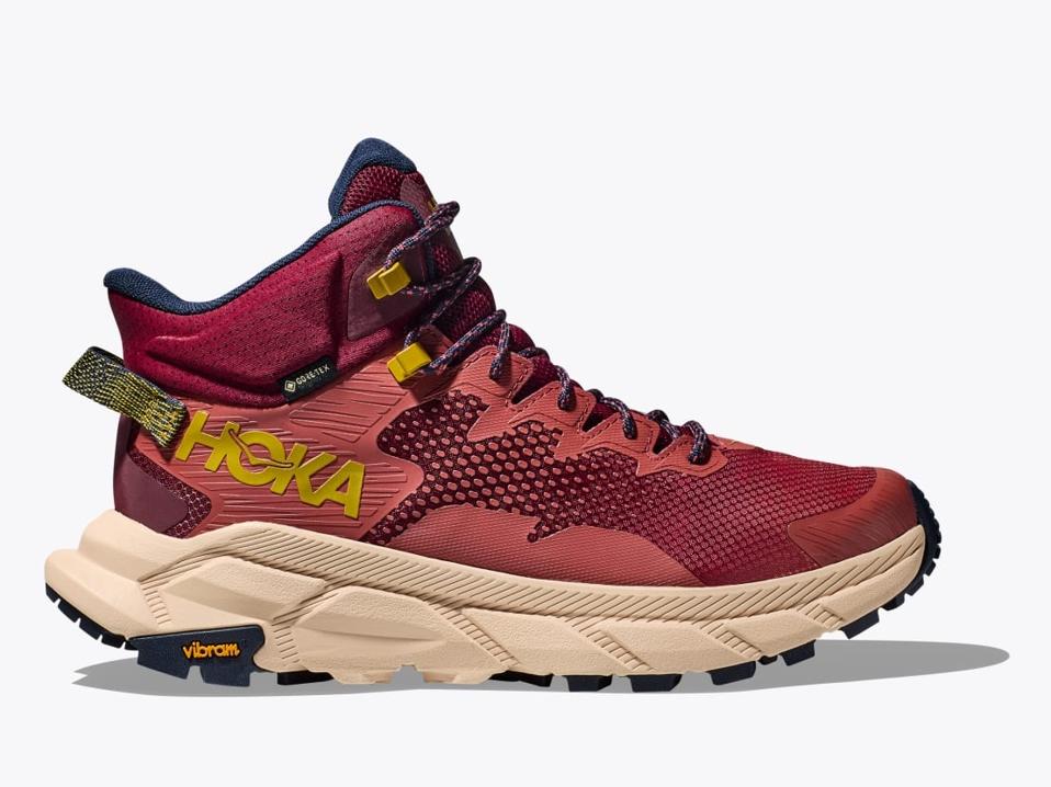 A Hoka Trail Code GTX hiking boot in the Hot Sauce / Shifting Sand