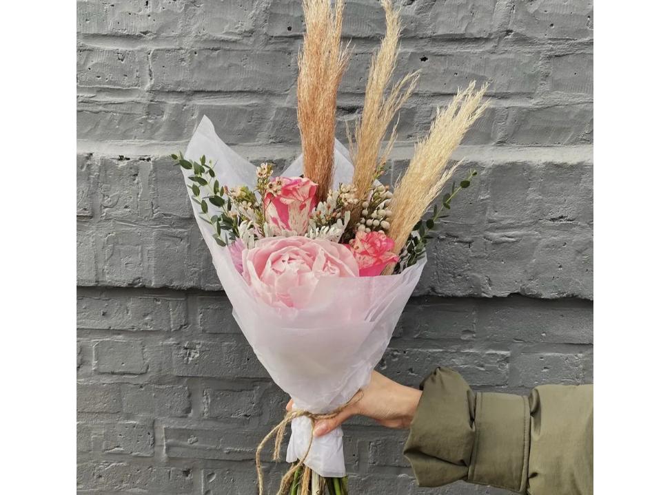 bloomnation Magic Flowers Compliment Bouquet nyc against gray brick wall mother's day