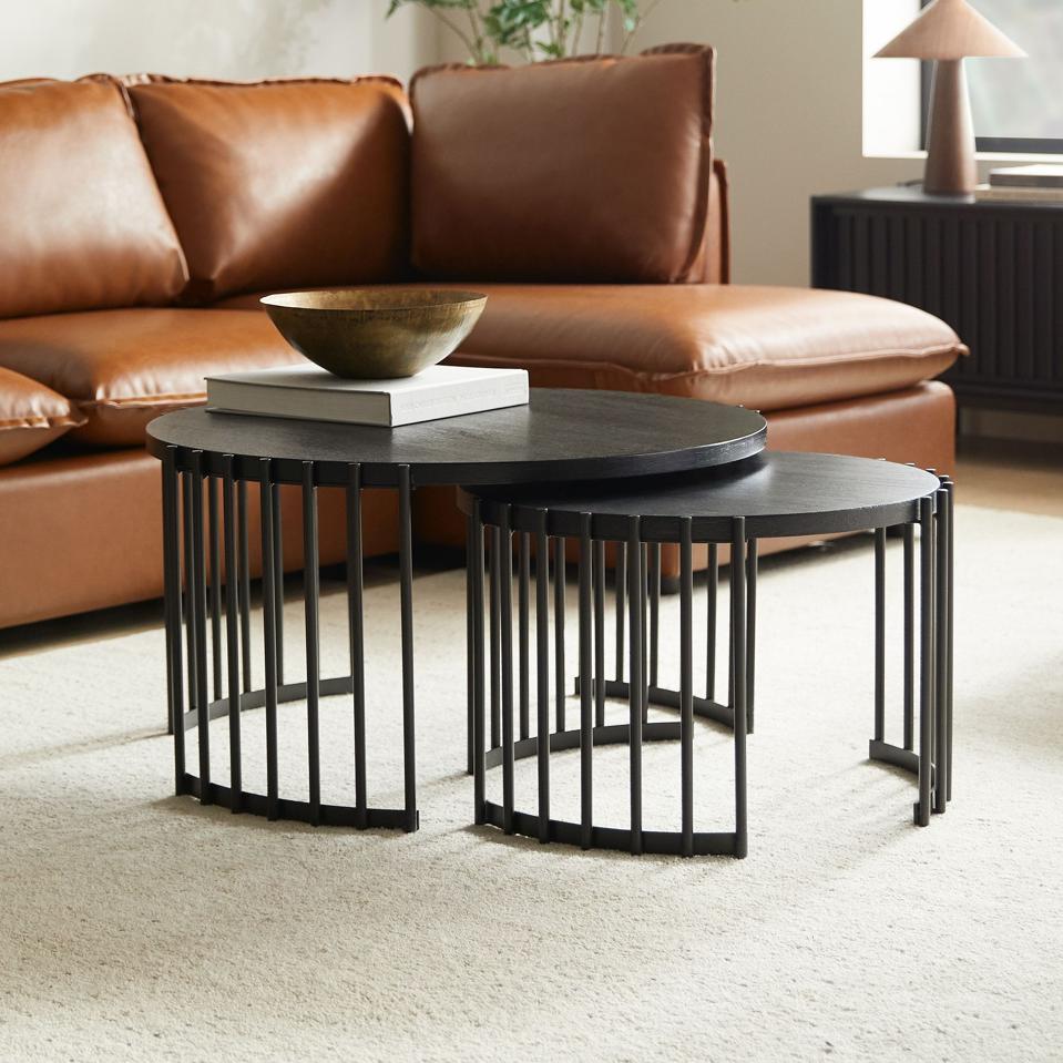 West Elm Spoke Nesting Coffee Tables in a living room with leather sofa.