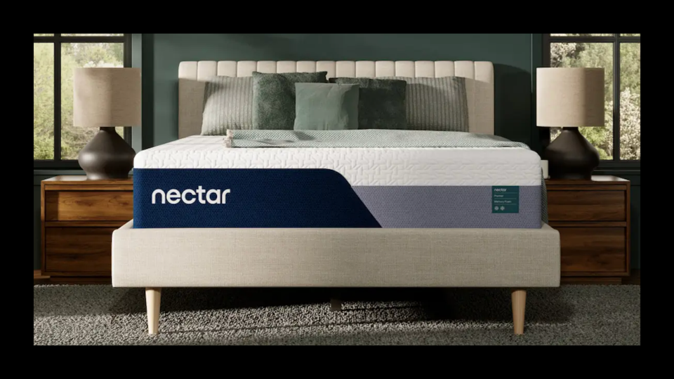 The Nectar Premier Mattress on top of a lightly colored bed frame. 