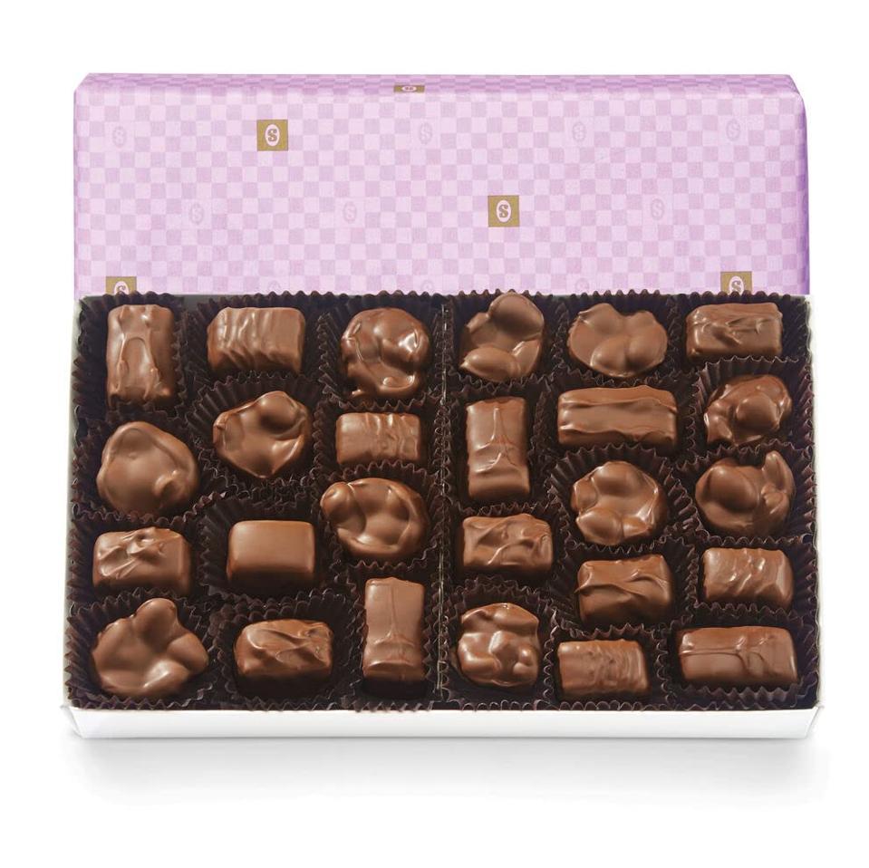 See's Candies Milk Chocolate Nuts & Chews (Lavender Wrap) on a white bacground