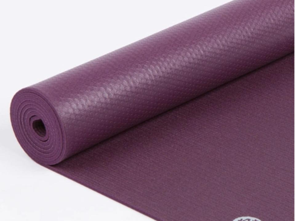 Purple rolled up Athleta yoga mat