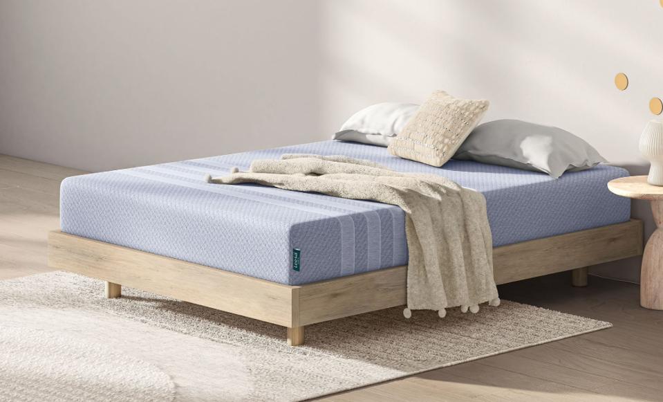 Leesa Studio Mattress on a gray upholstered bed frame. 