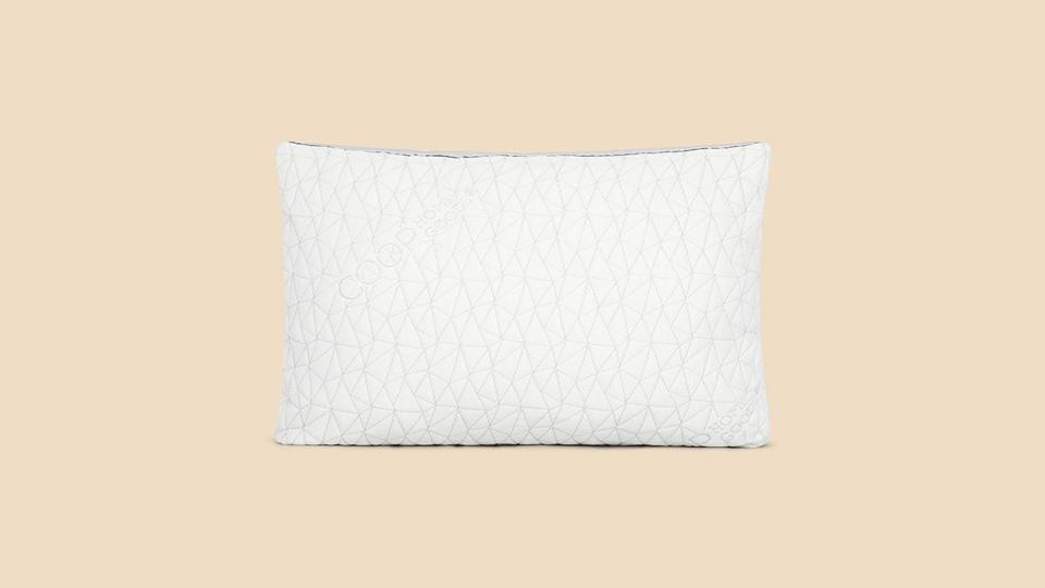 The Coop Sleep Goods Eden Shredded Memory Foam Pillow on a beige background.