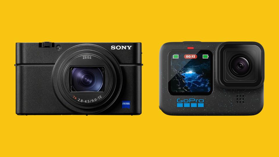 Two point-and-shoot cameras on a bright mustard yellow background