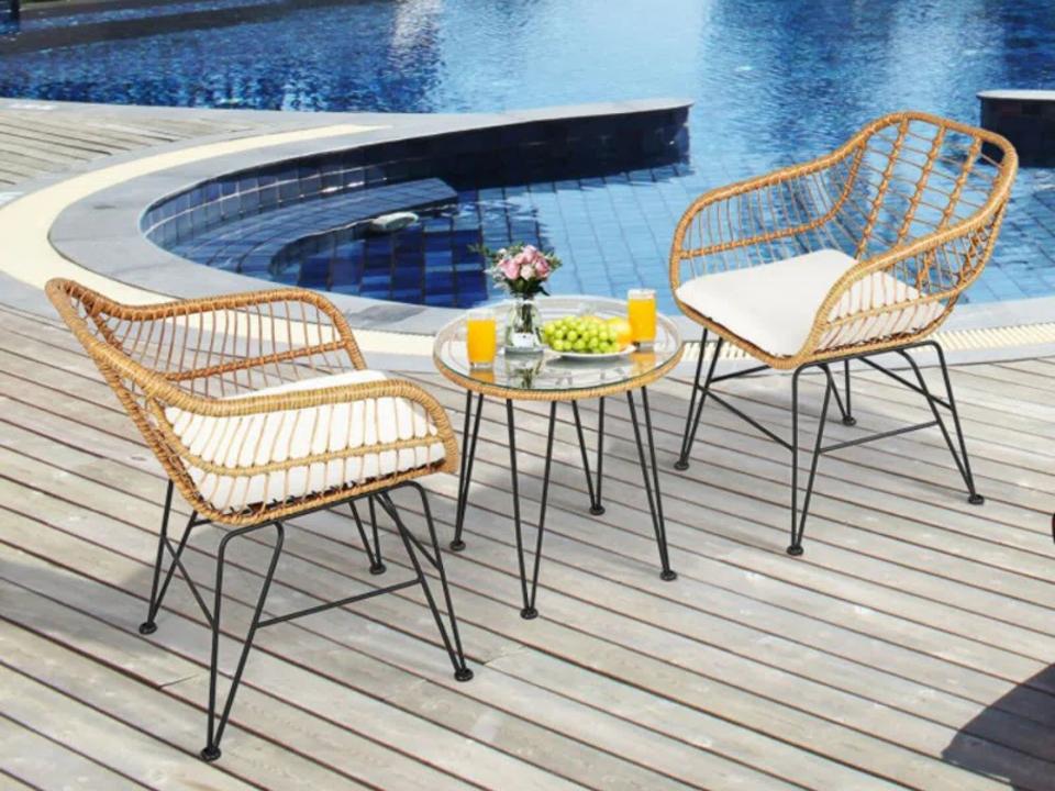 Corrigan Studio Brookley Two-Person Round Outdoor Dining Set near pool.