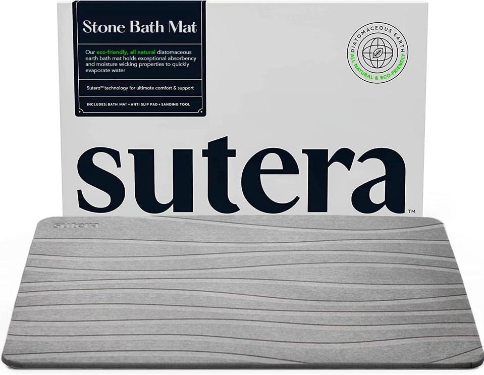 Sutera Stone Bath Mat on a white background.