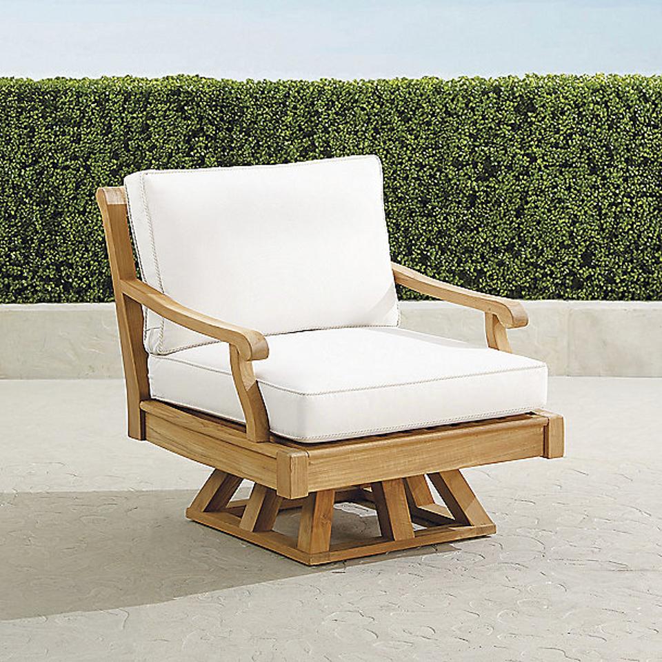 Frontgate Cassara Swivel Lounge Chair on an outdoor patio.