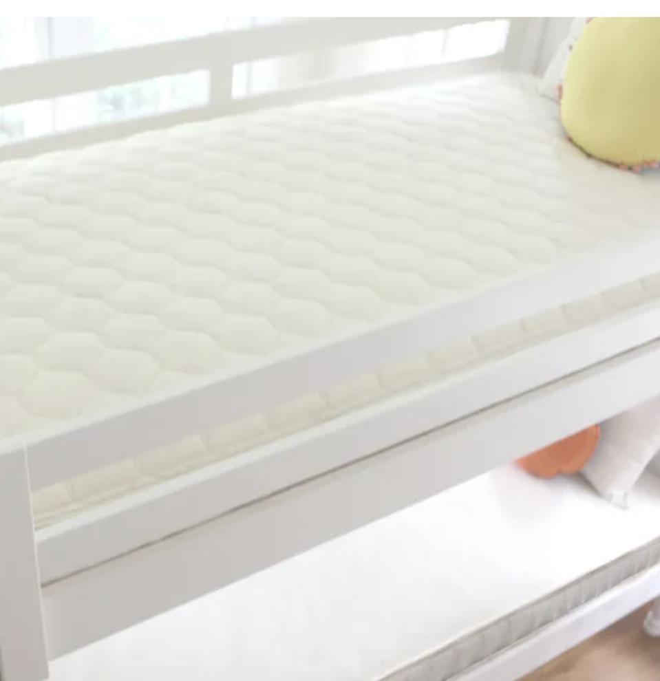 Naturepedic mattress on a top bunk