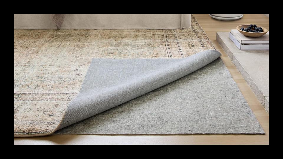 The Loloi Grip Rug Pad underneath an area rug.