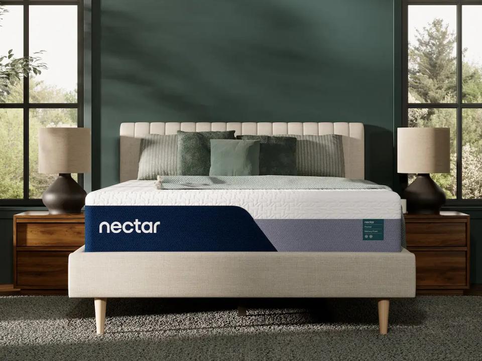 Lifestyle image of the Nectar Premier Memory Foam Mattress in a green bedroom.