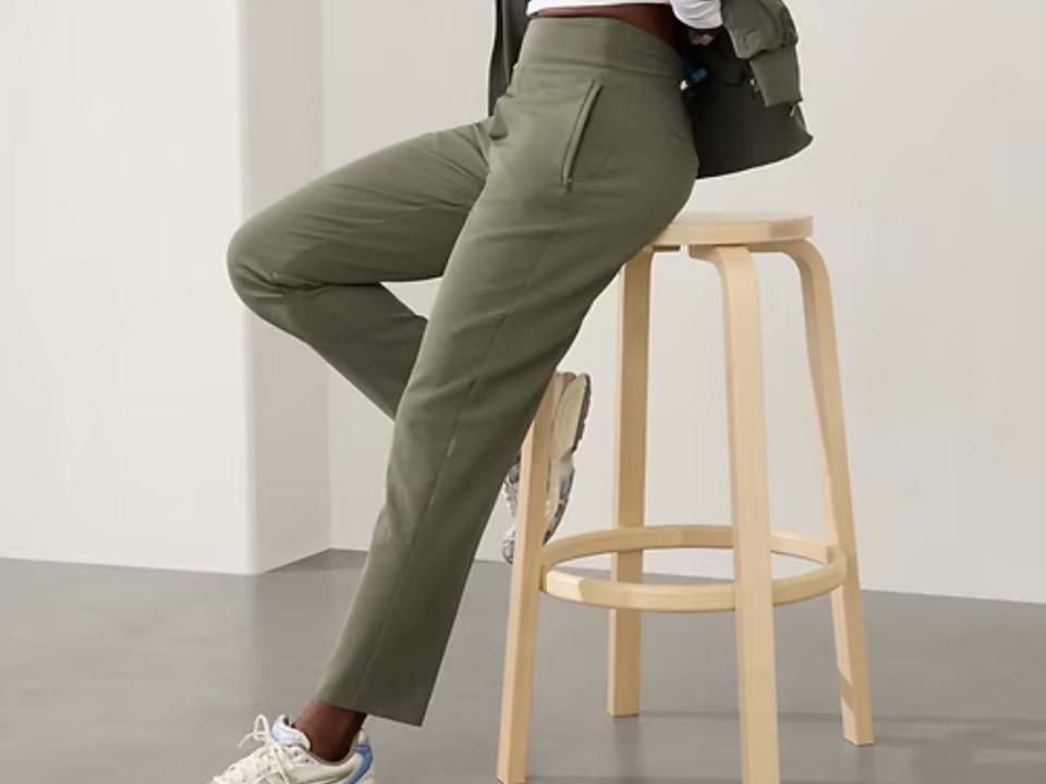 Woman resting on stool showing off the Athleta endless high rise pant