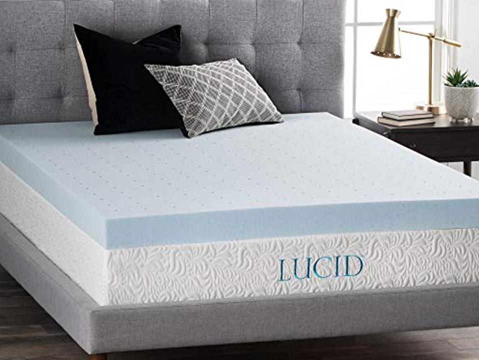 A blue Lucid Mattress Topper on top of a Lucid Mattress. 