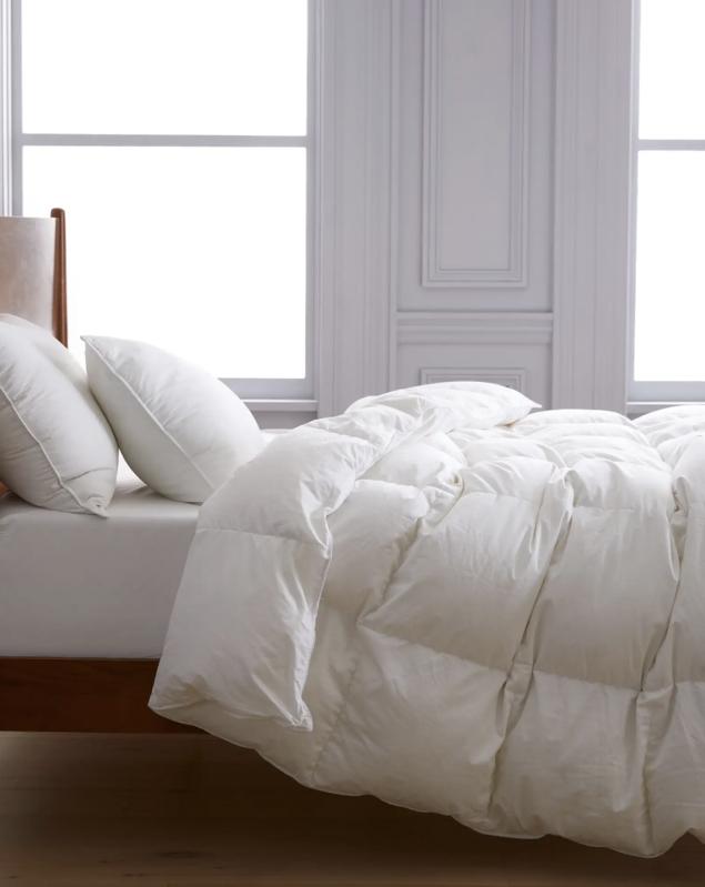 Quince Down Alternative comforter and two pillows on a bed