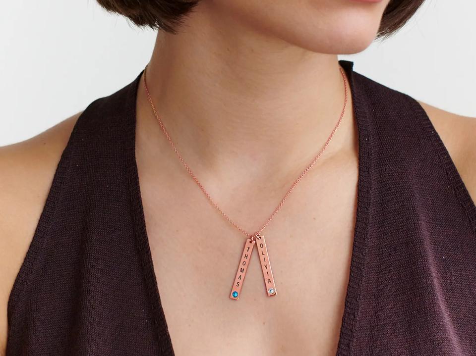 close-up of woman wearing rose Vertical Bar Necklace with Birthstone necklace