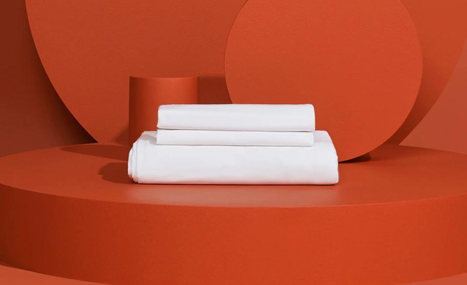 Slumber Cloud Performance Sheet Set on a burnt orange background.